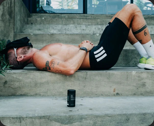An older athlete resting between sets