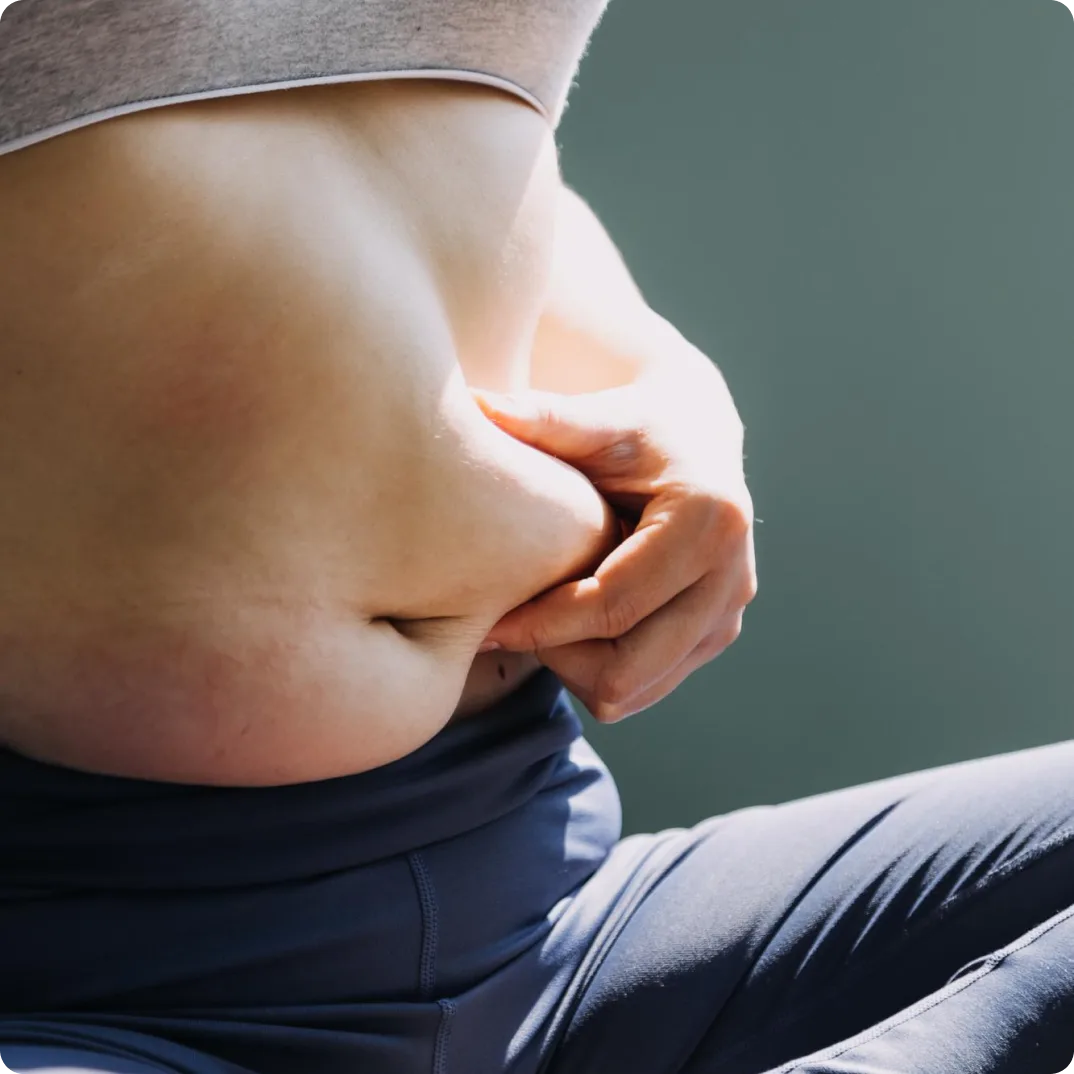 A woman holding her stomach